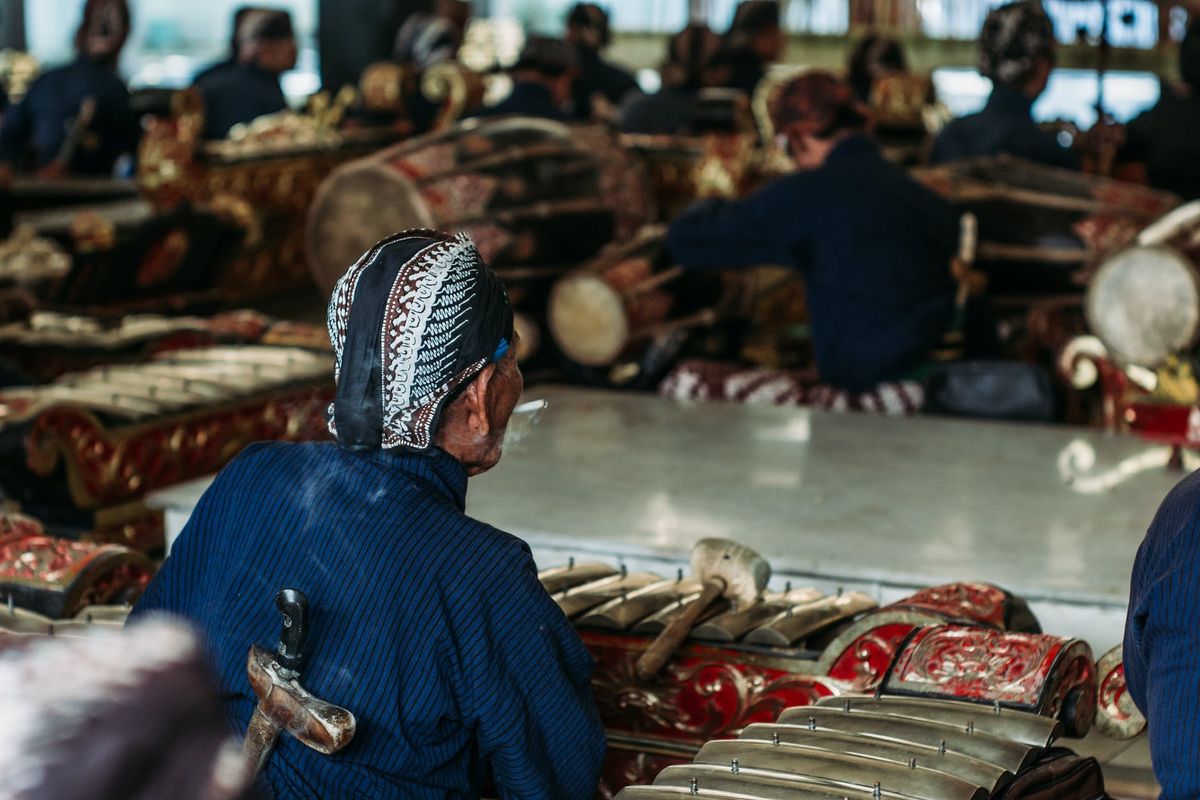 back view of a person sitting smoking