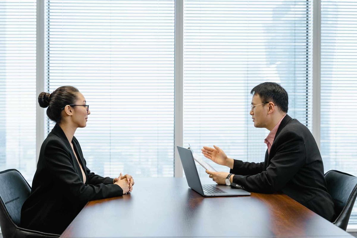 man interviewing a woman